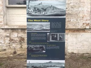 meat works information board, outlining the history and evolution of the building on the banks of the Maribyrnong River